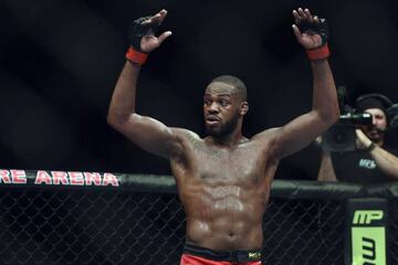 Jon Jones puts his arms in the air after the UFC light heavy weight championship fight against Glover Texeira.